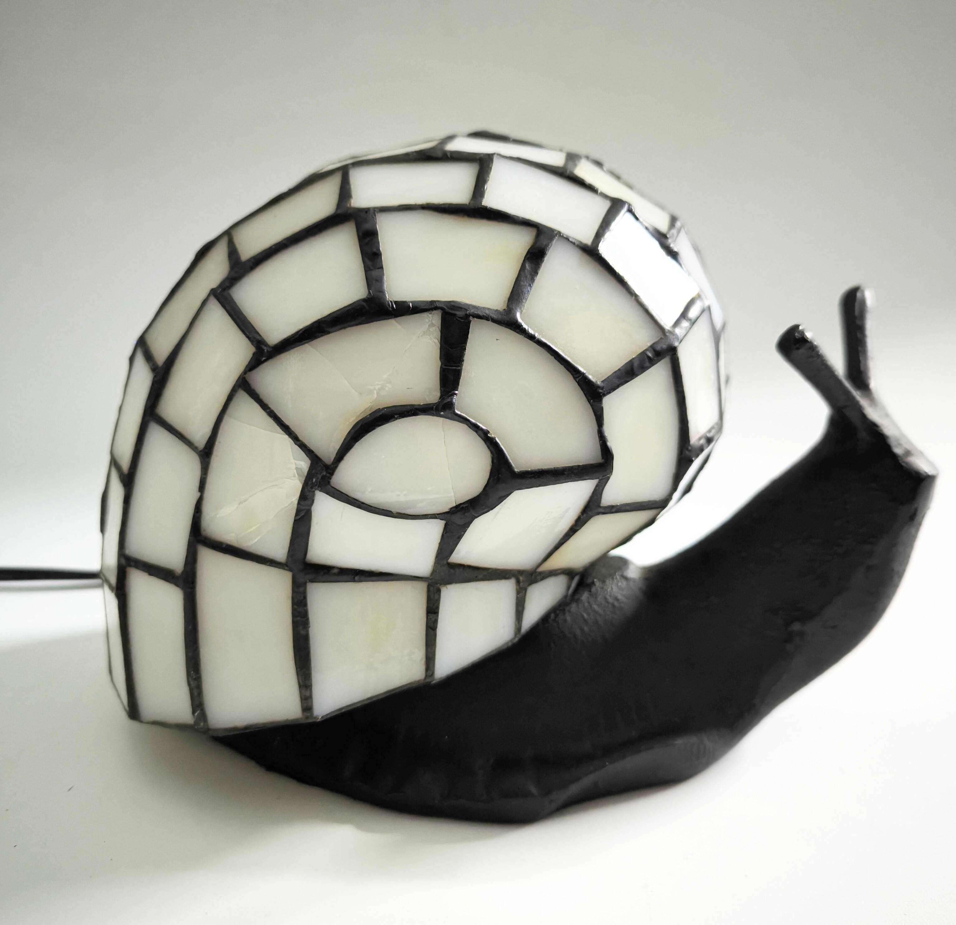 Tiffany-style lamp in the shape of a snail.