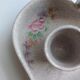 Vallauris grey candle holder with pink flowers, signed.