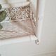Vintage rattan and bamboo shelves painted white
