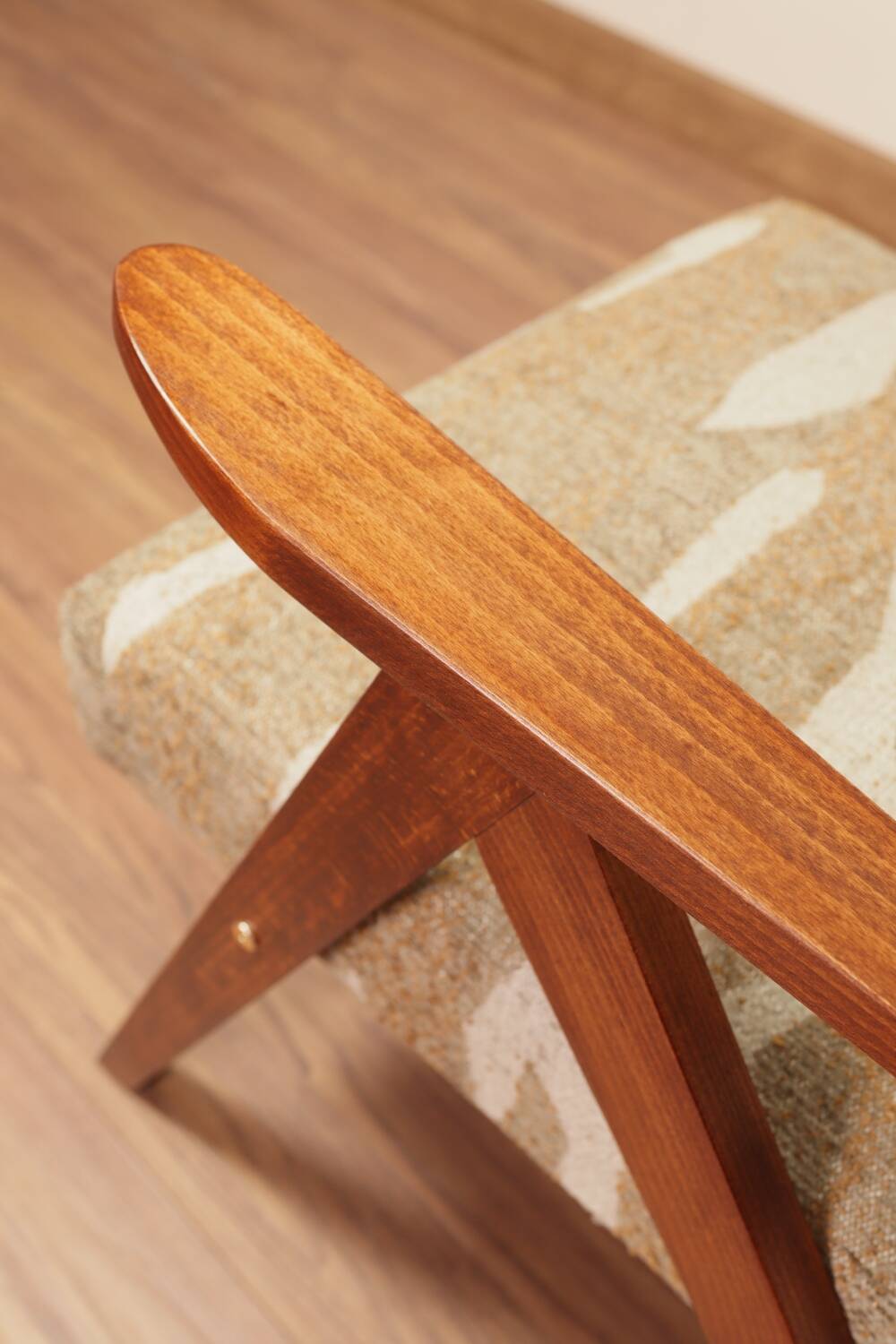 Pair of vintage lounge chairs in brown jacquard fabric and wood.