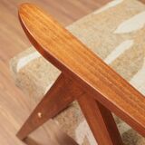 Pair of vintage lounge chairs in brown jacquard fabric and wood.