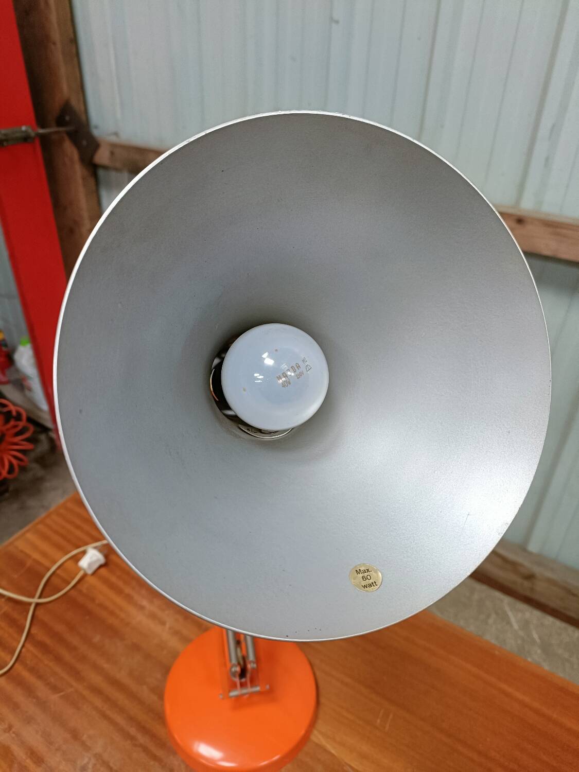 Luxo L4 vintage orange lamp with foot