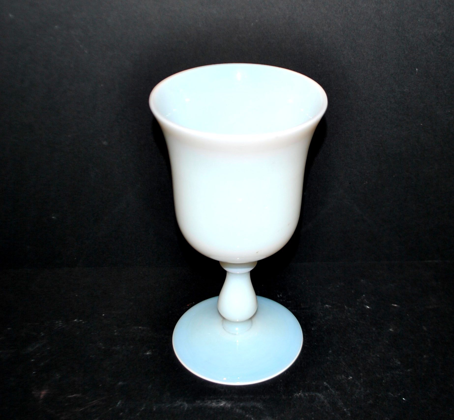 Ancient opaline white glass goblet with a soap bubble effect.