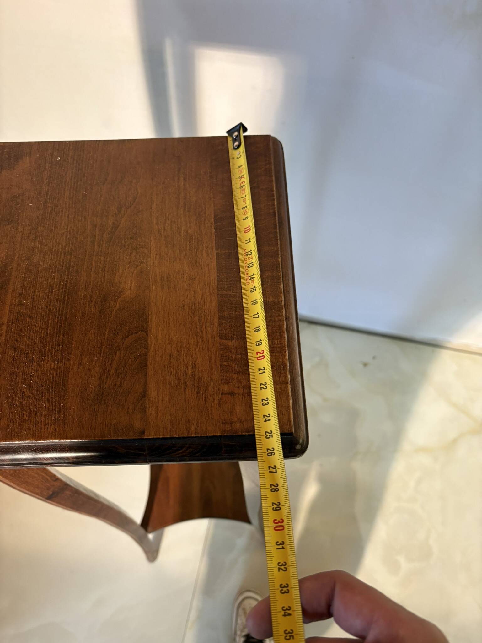 Vintage dark wood side table with curved base