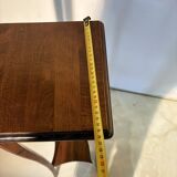 Vintage dark wood side table with curved base