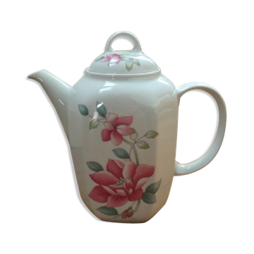 Vintage porcelain coffee or teapot with milk jug