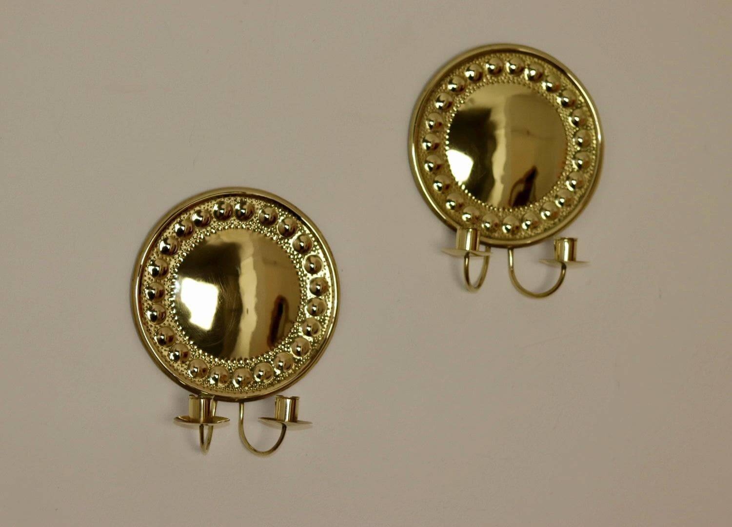 A pair of Swedish brass wall lights from the 1970s.