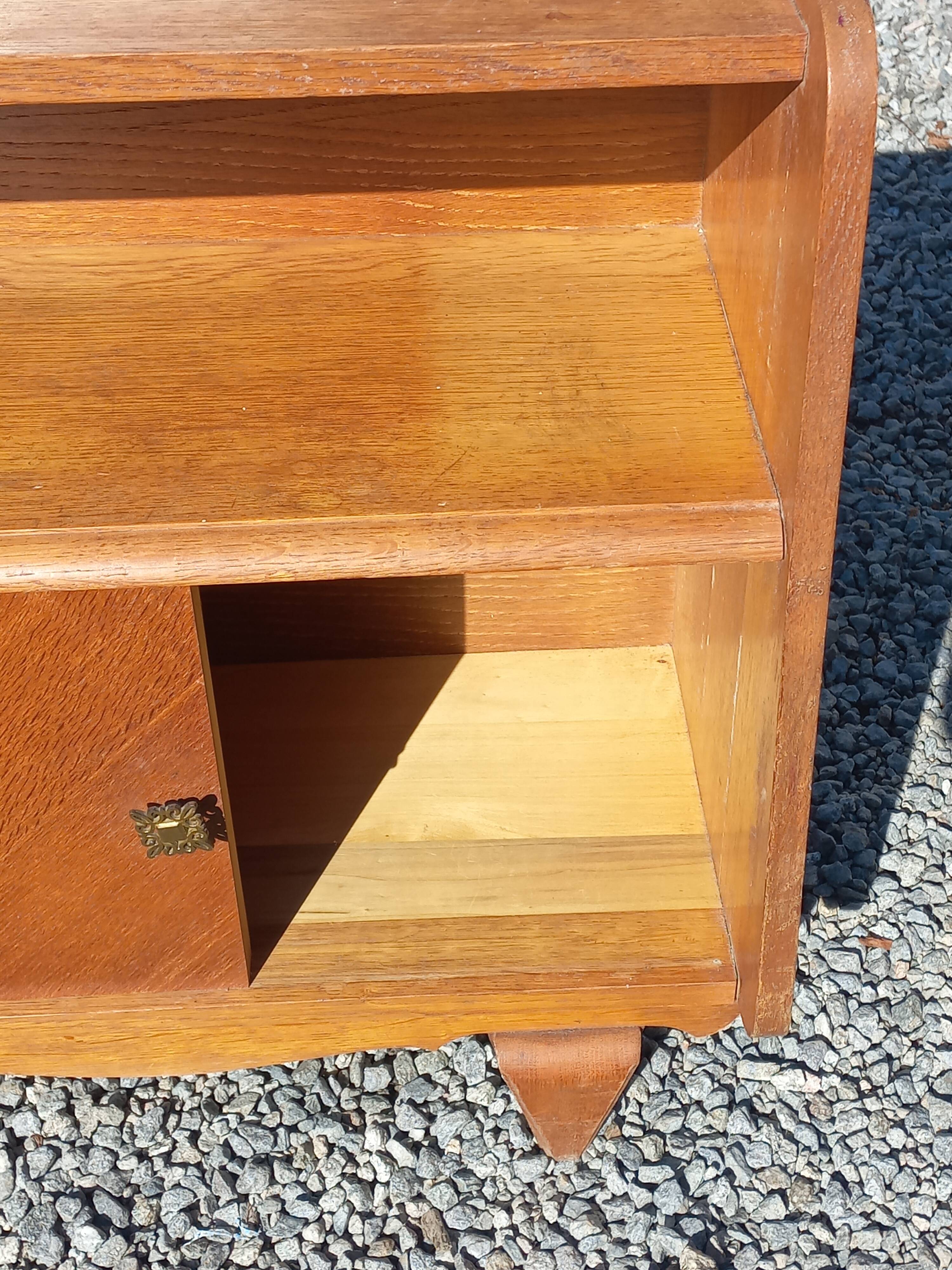 Vintage accent furniture in golden blonde oak with 2 sliding doors.