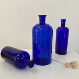 Trio of apothecary bottles in cobalt blue glass
