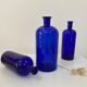 Trio of apothecary bottles in cobalt blue glass