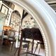 Oval mirror in pearl-coloured stucco 85 x 114 cm