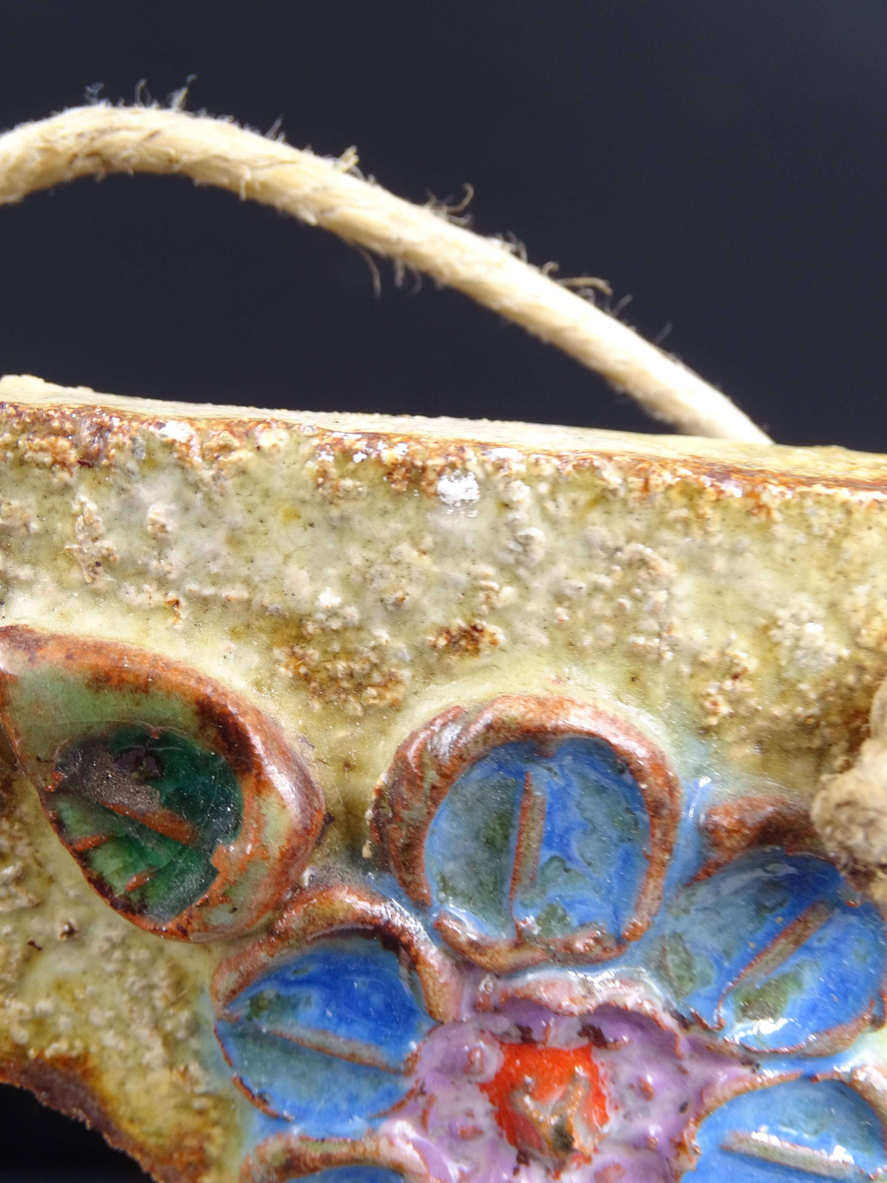 Flower-decorated sandstone mirror, circa 1970