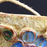 Flower-decorated sandstone mirror, circa 1970