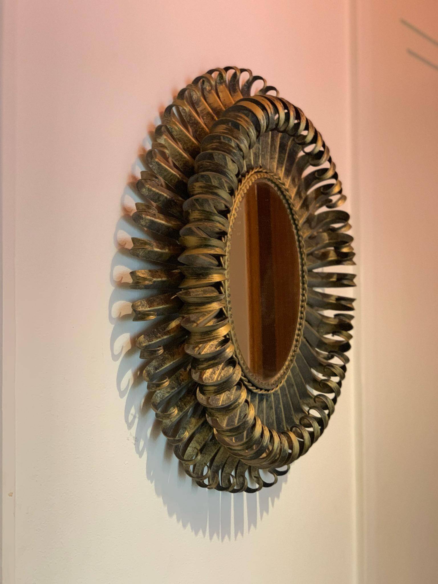Golden iron star-shaped mirror, mid-1900s.