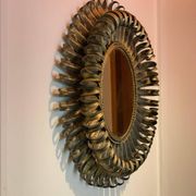 Golden iron star-shaped mirror, mid-1900s.