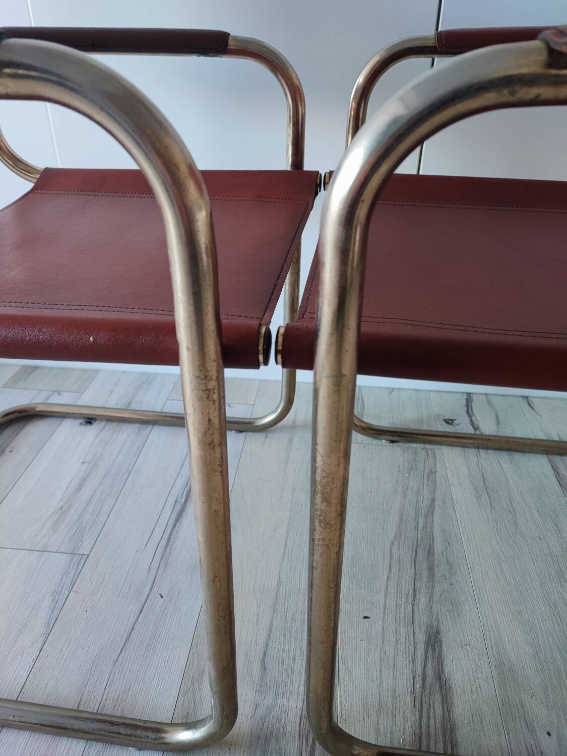 B34 armchairs, cognac leather and gilding