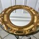 Miroir ovale médaillon en stuc doré années 70