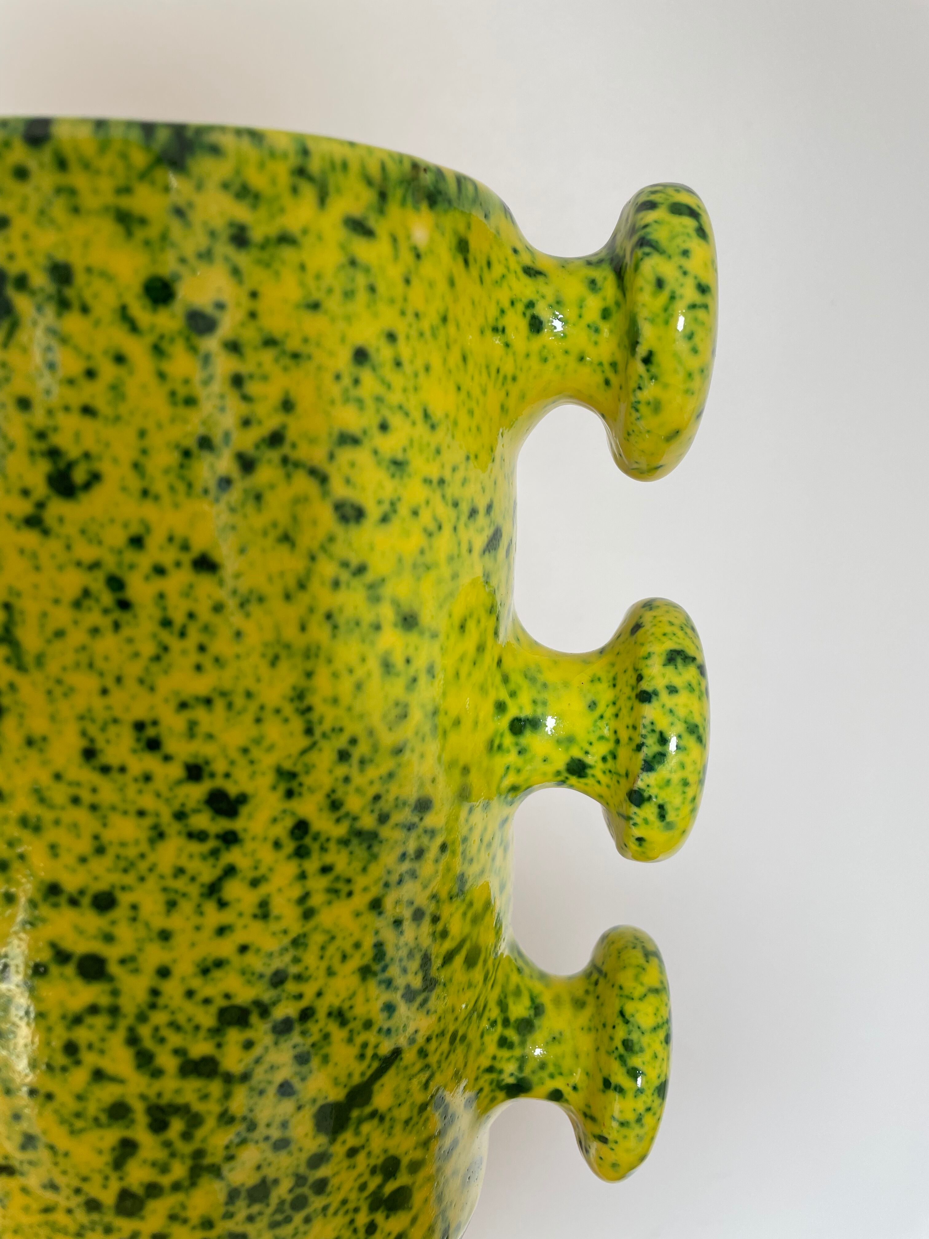 Handmade green speckled yellow ceramic vase with abstract handles