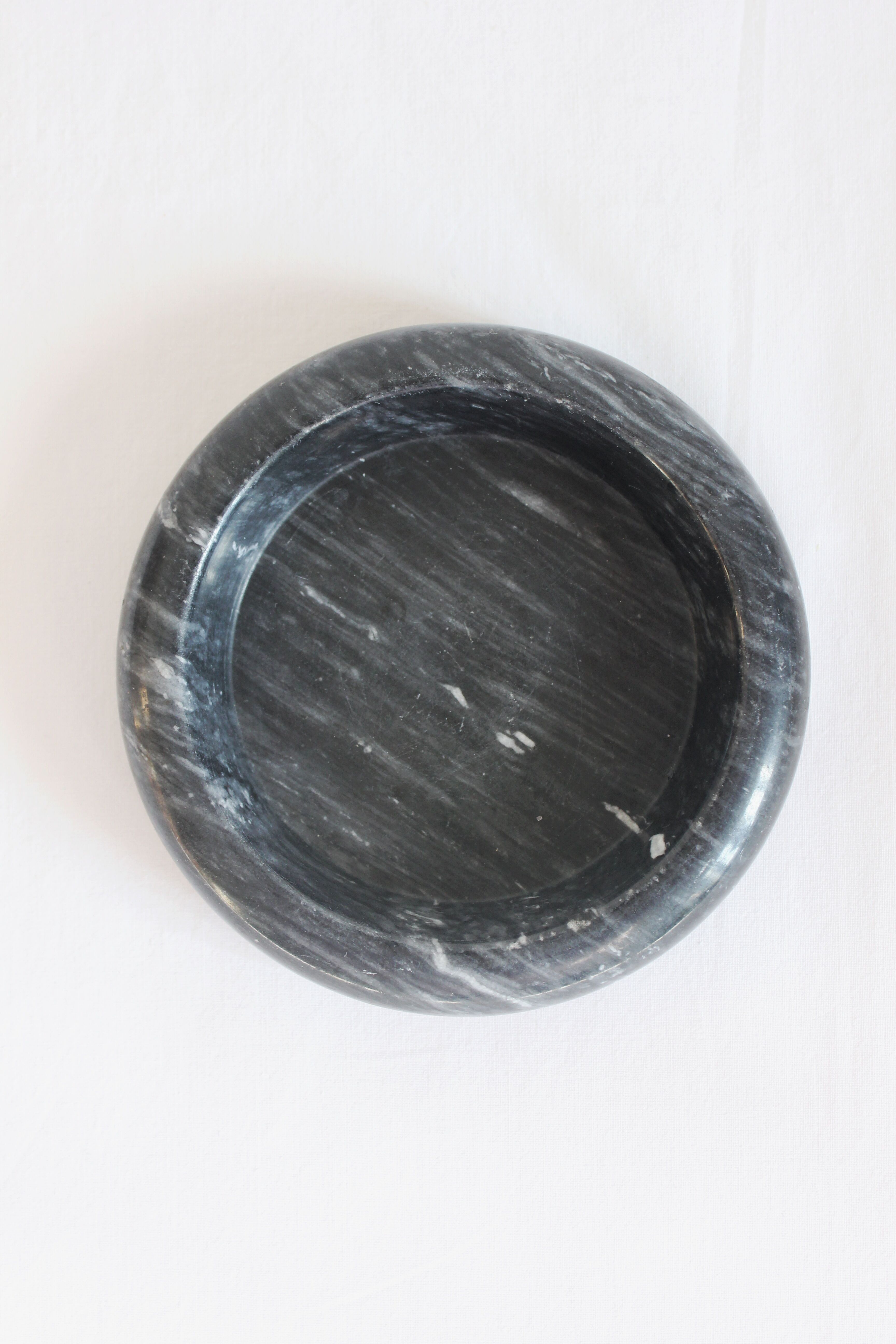 Ashtray or empty black marble pocket