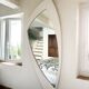 Dismantled Space Age XXL wall mirror in lacquered wood. France, 1970s.