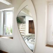 Dismantled Space Age XXL wall mirror in lacquered wood. France, 1970s.