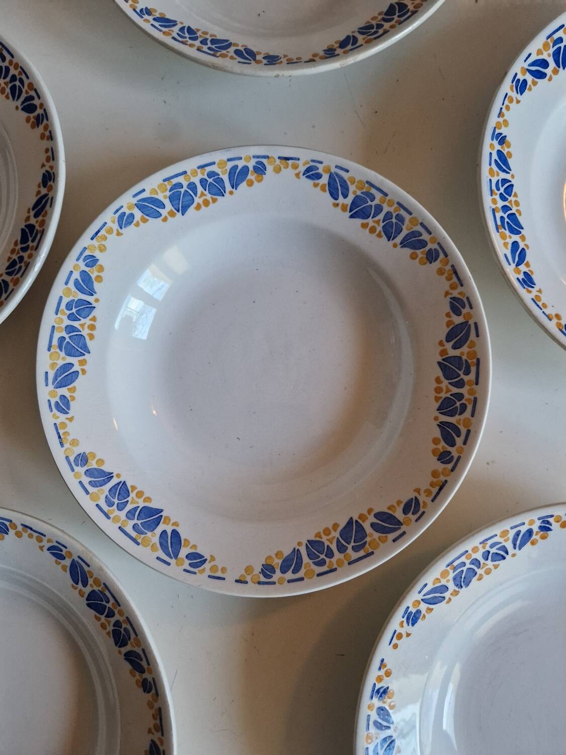 Set of 9 deep plates, earthenware from Creil Montereau, Colette model.