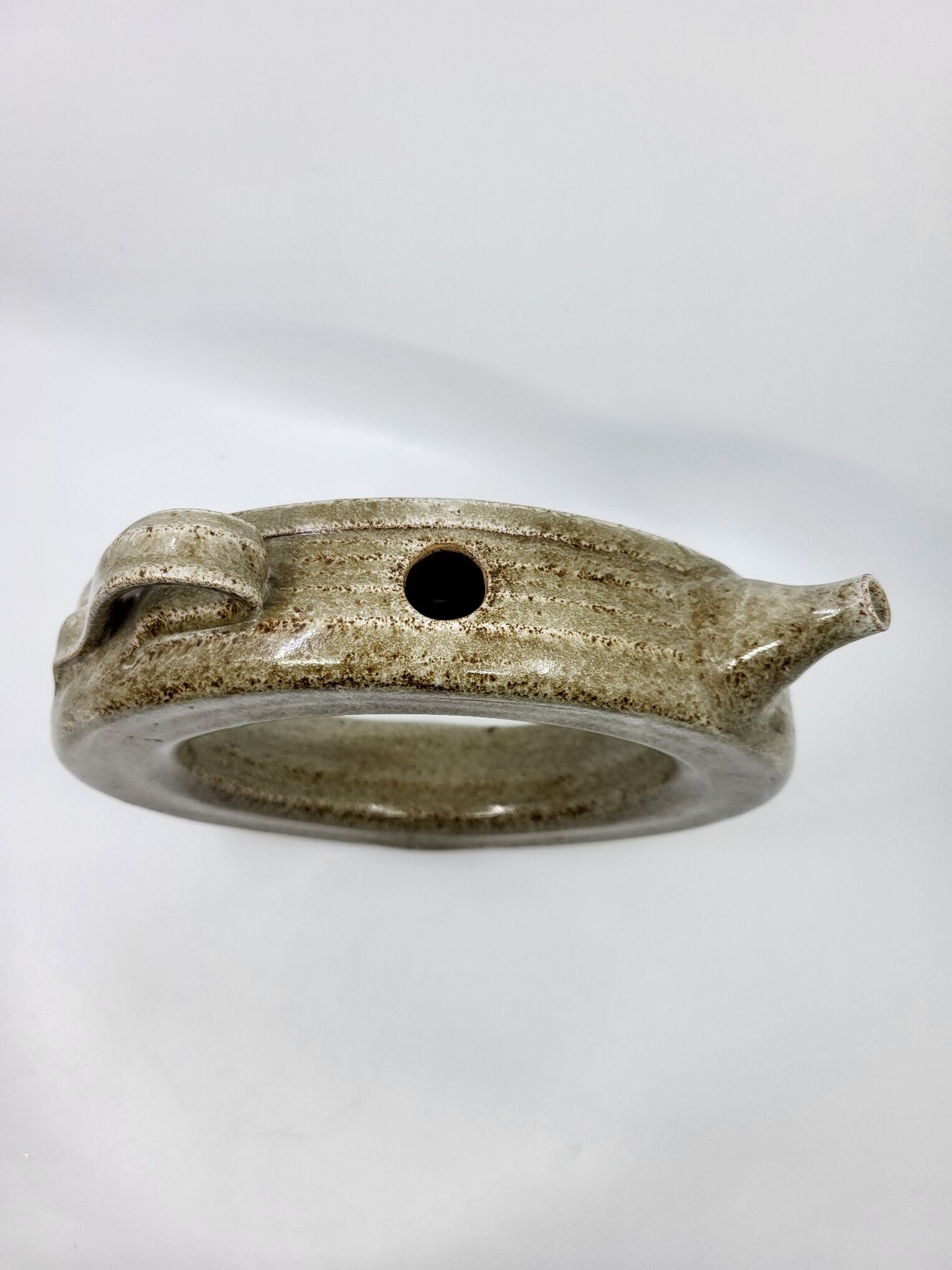 Vintage glazed stoneware pitcher in sculptural ring shape (1970s)