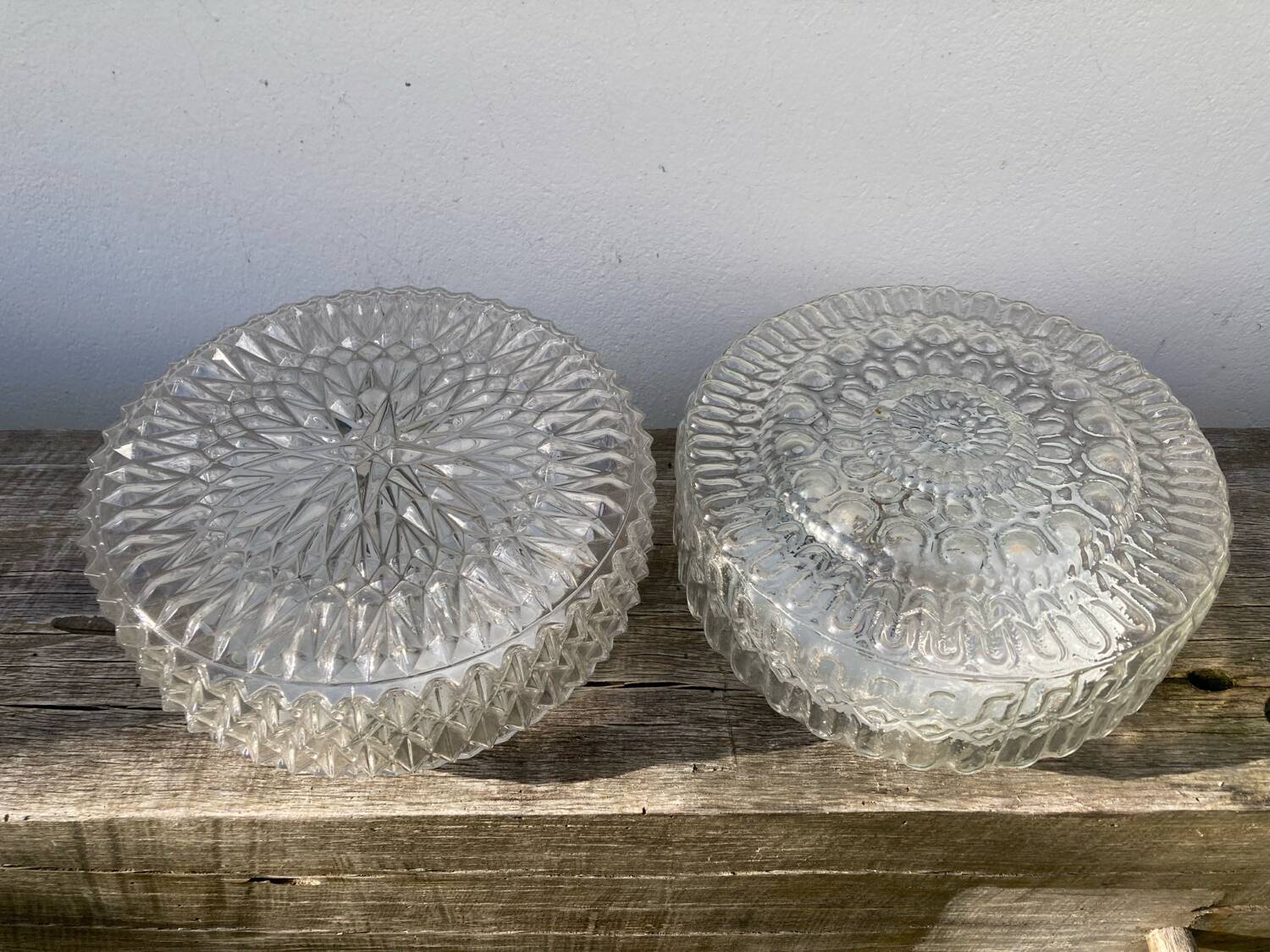 Pair of transparent round glass wall lights