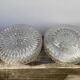 Pair of transparent round glass wall lights