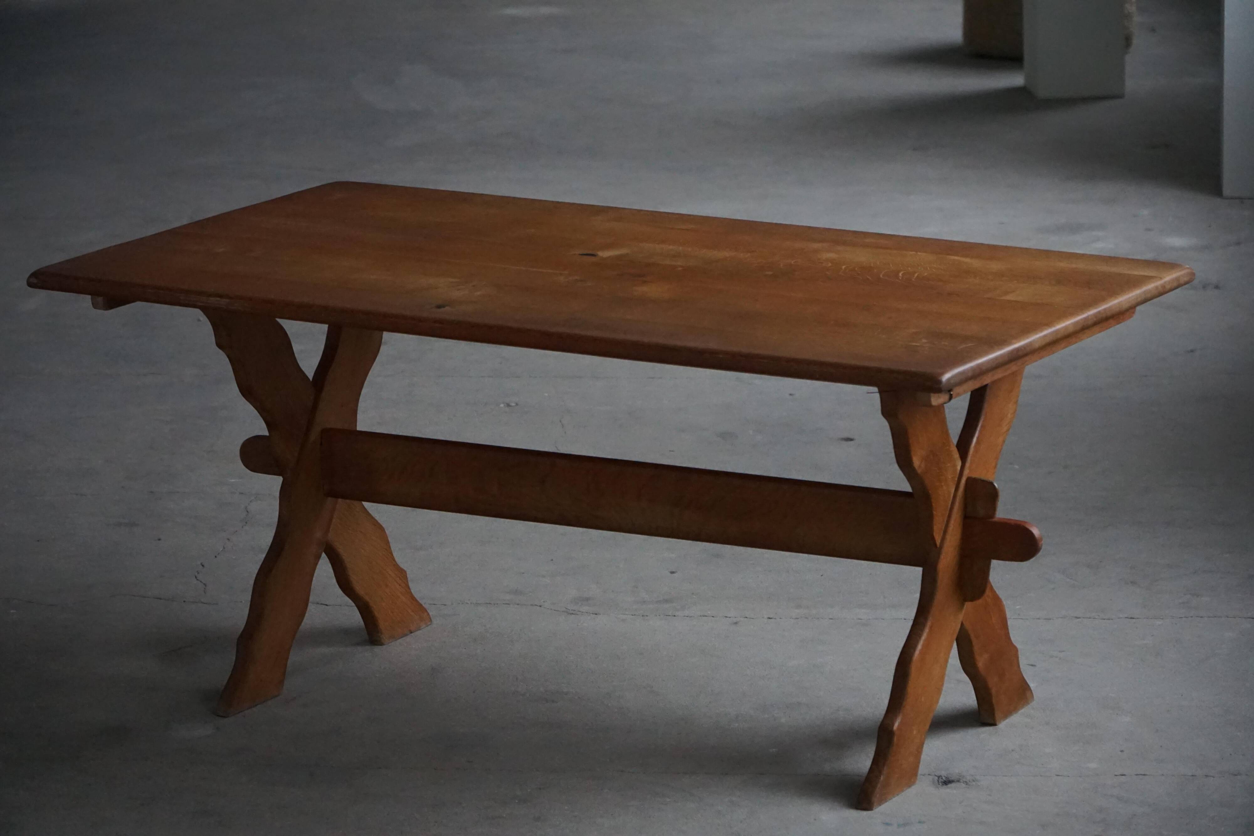 Solid oak dining table with cross base by Danish cabinetmaker, mid-20th century.