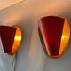 Pair of orange plexiglass and curved brass wall lights, 1950s, Germany
