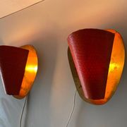 Pair of orange plexiglass and curved brass wall lights, 1950s, Germany