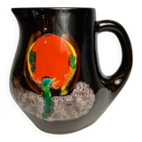 Brown ceramic pitcher with coloured patterns signed Bresse.