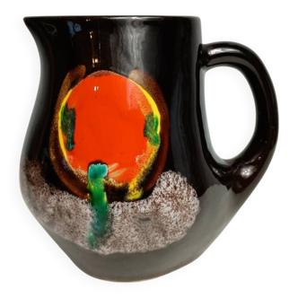 Brown ceramic pitcher with coloured patterns signed Bresse.