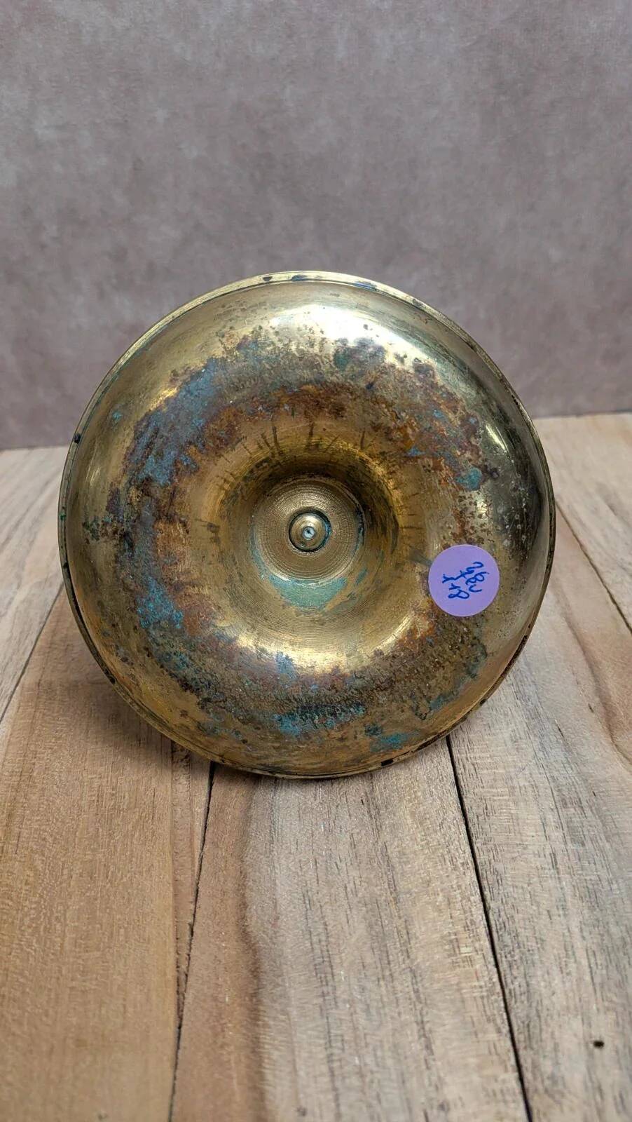 Antique brass candlestick with pusher