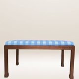 Ottoman coffee table in wood and gingham fabric.