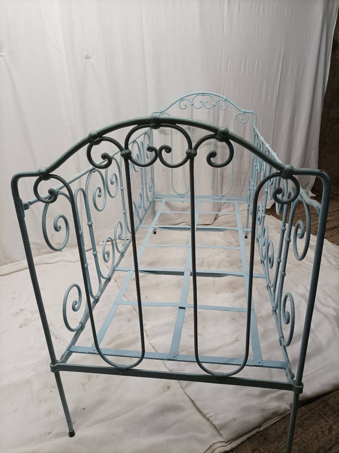Old children's bed with metal bars