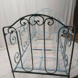 Old children's bed with metal bars