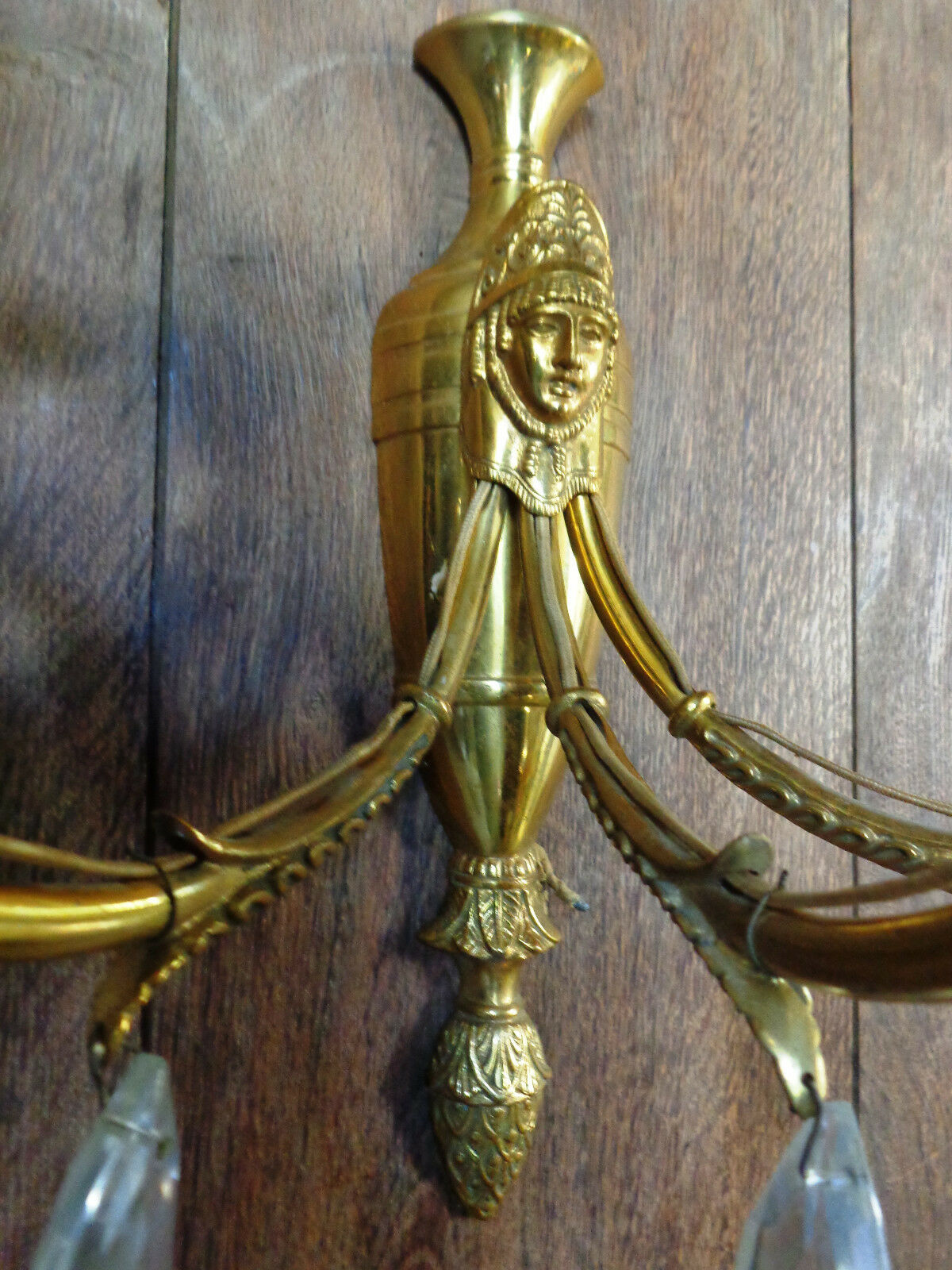 Ancient wall lamp in gilded brass with stamps