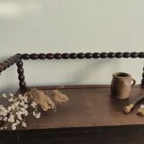 Natural wood chest forming a bench, ringed shoulders