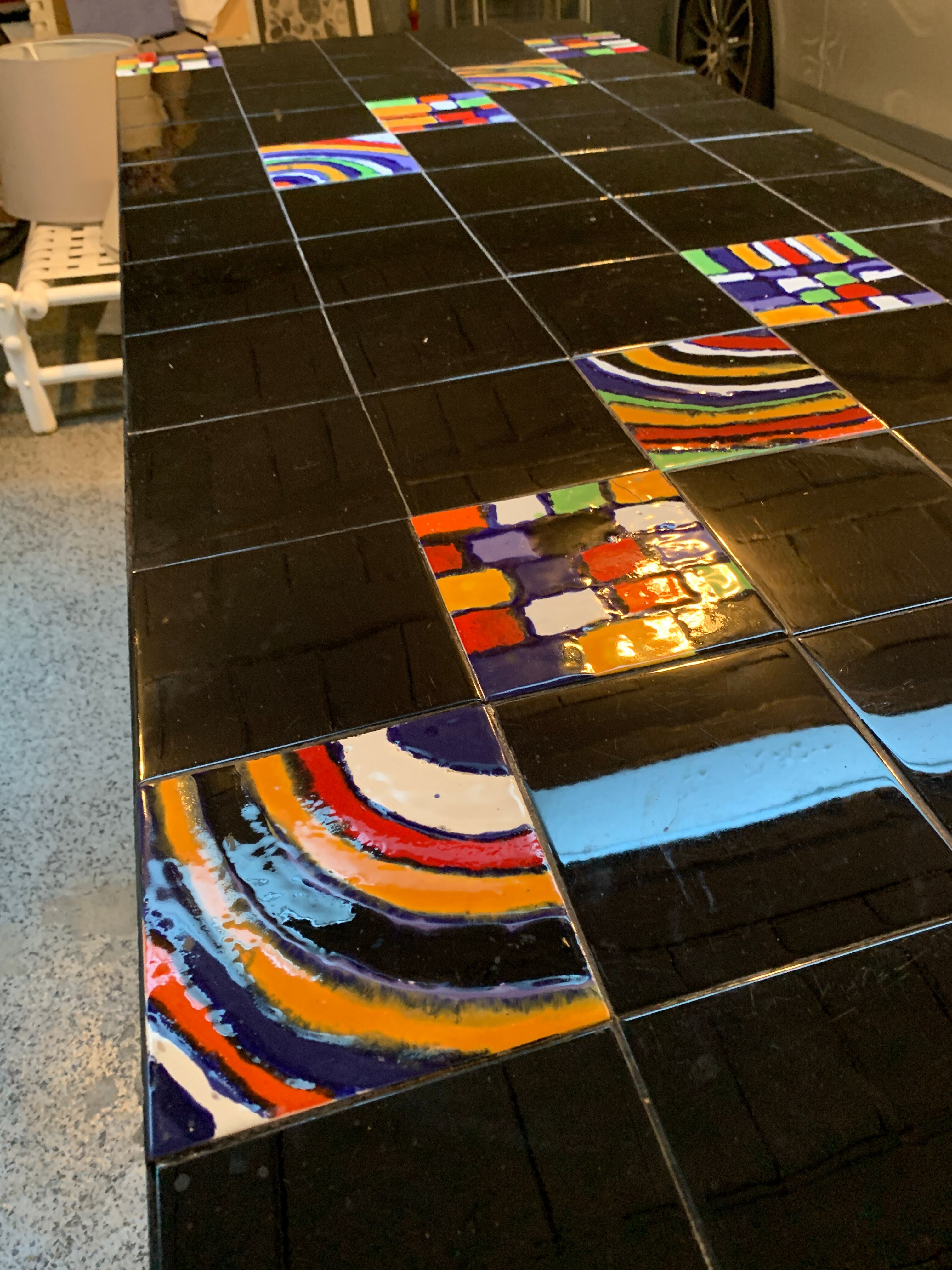 Dining table with metal base in X and painted ceramic tile cladding, 50s.