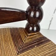Brutalist wood turned bobbin low rush chair n the style of Charles Dudouyt