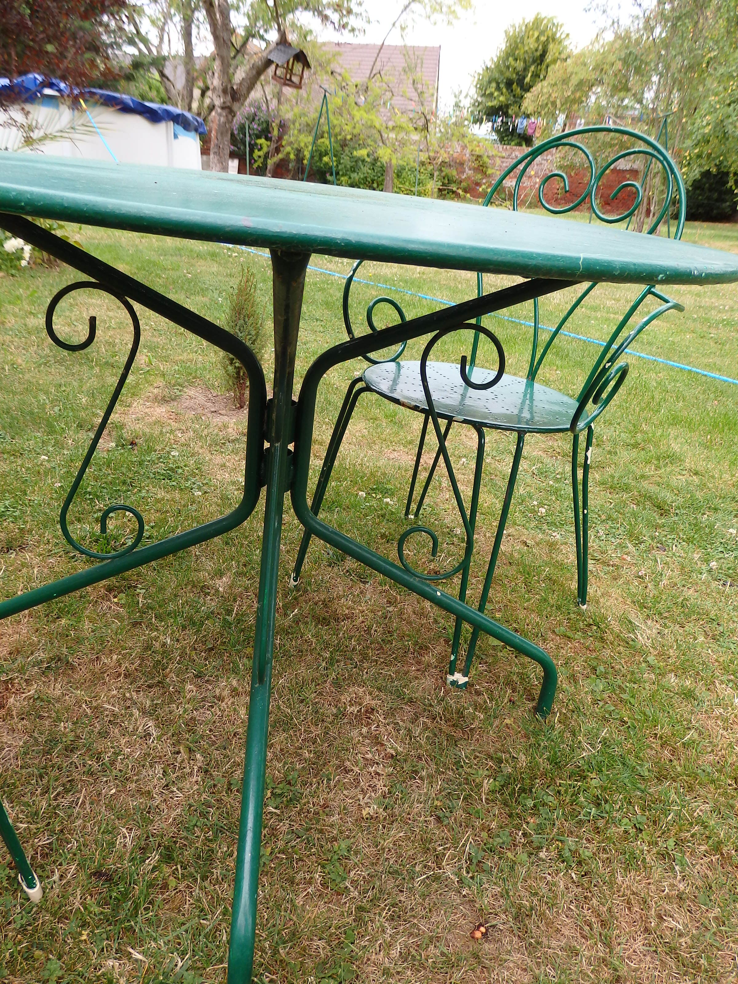Wrought iron garden lounge table and 2 armchairs
