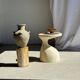 Light beige-grey Indonesian terracotta vase with 4 small handles and a high neck.