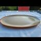 Oval dish in speckled enamelled stoneware