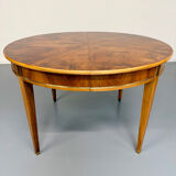 Round walnut Napoleon III extendable table with bronze top in good condition.