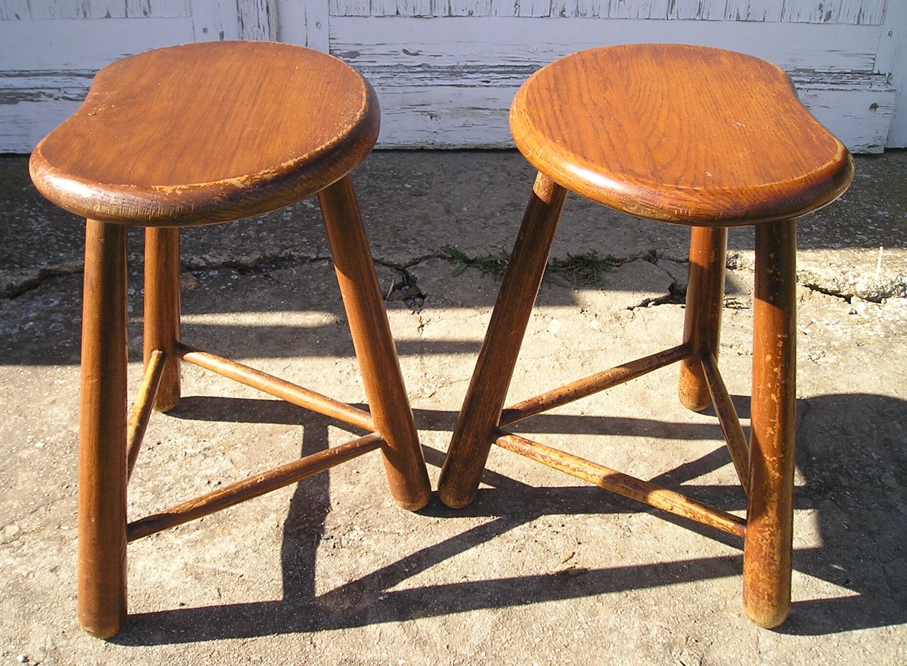 Pair of 70s wooden tripod stools