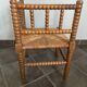 Old armchair, corner chair, made of wood and straw