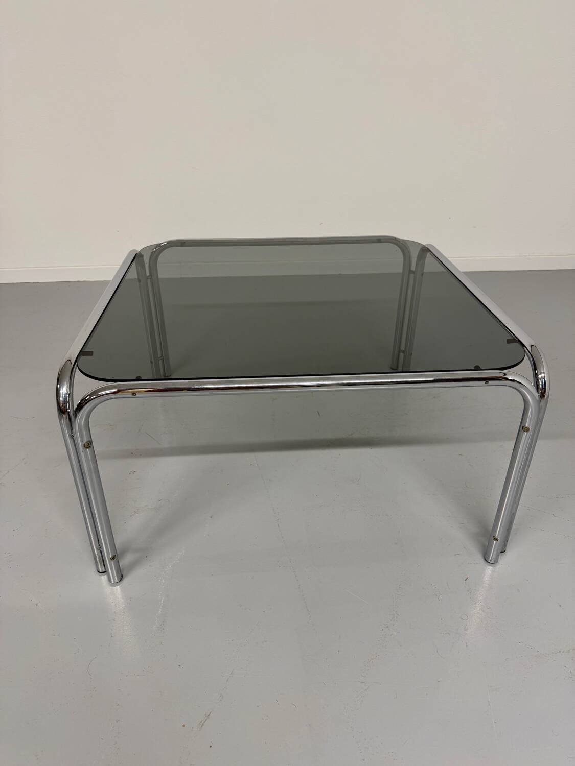 Space coffee table from the 70s, tubular metal and vintage smoked glass