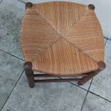 Vintage low stool with straw seat